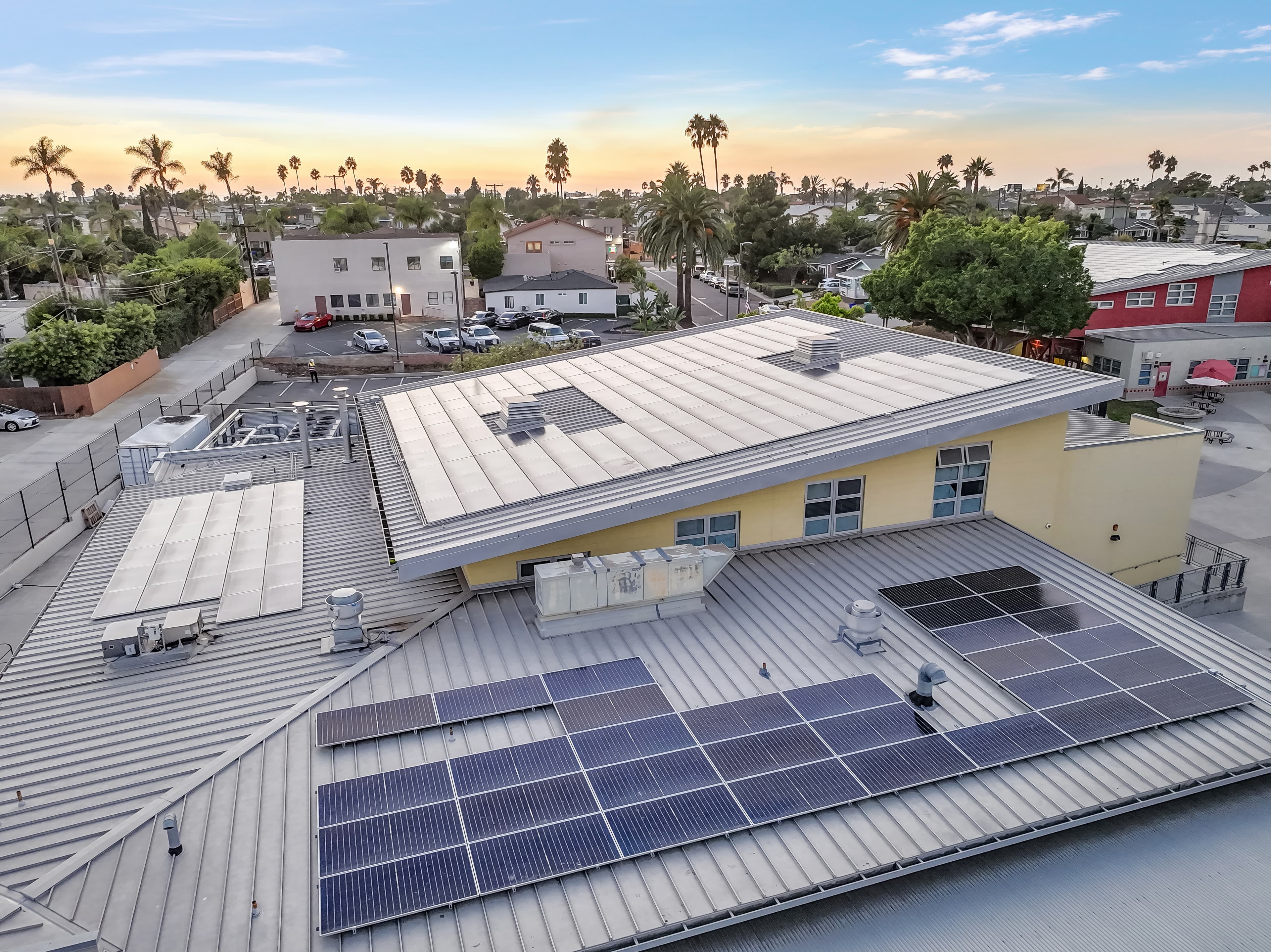 Technician installing solar panels for a nonprofit organization